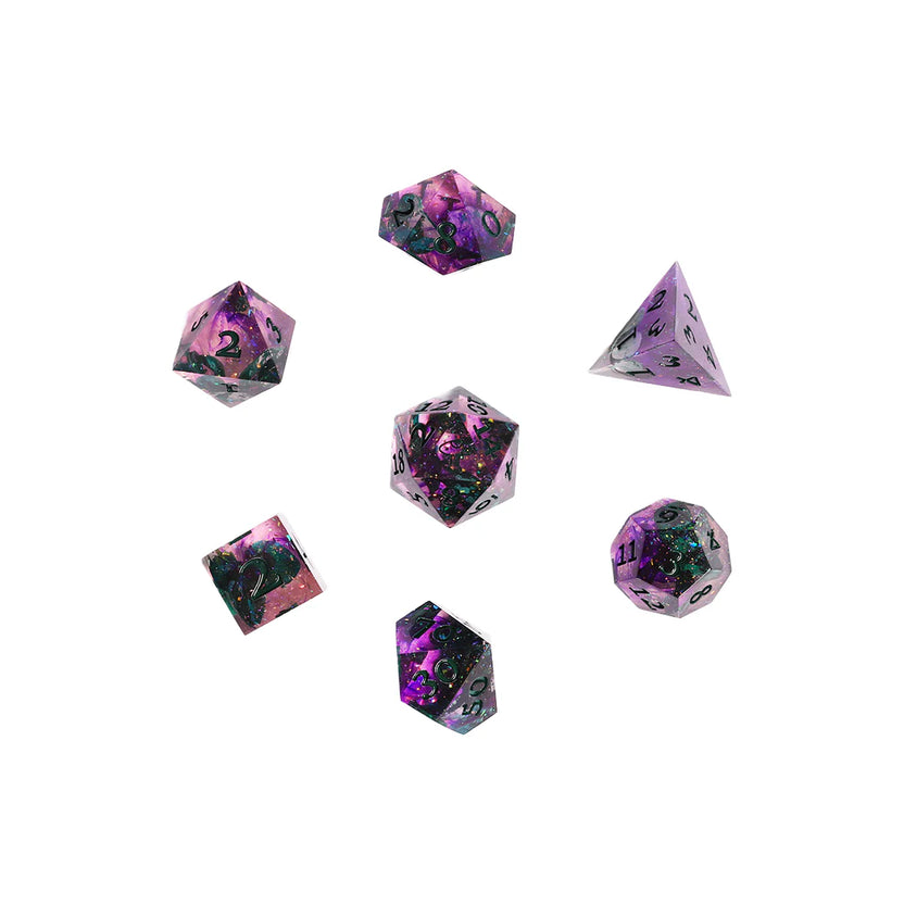 Close-up of the seven polyhedral dice included in the Critical Role Champion Dice Set inspired by Caduceus Clay. The sharp-edged resin dice feature swirling shades of pink, purple, and black with iridescent shimmer, green botanical inclusions, and dark green numbering. The custom d20 displays a mushroom icon, reflecting Caduceus's connection to nature, growth, and quiet wisdom.