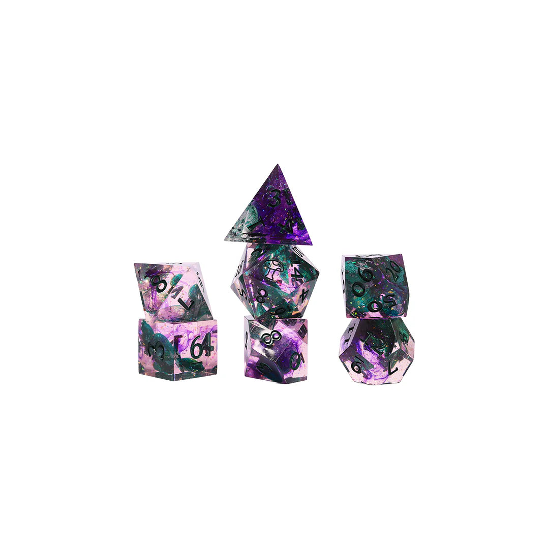 Seven sharp-edged polyhedral dice from the Critical Role Champion Dice Set inspired by Caduceus Clay arranged in a stacked display. The resin dice feature swirling pink, purple, and black tones with iridescent shimmer, green botanical inclusions, and dark green numbering. The set evokes the natural beauty, growth, and quiet strength associated with the beloved Mighty Nein cleric.