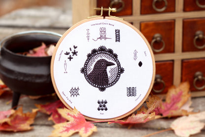 crow embroidery stitch sampler, Kiriki Press embroidery kit, beginner embroidery sampler, how to embroider sampler kit, blackwork stitches, DMC floss kit, embroidery hoop art, stitched crow pattern, learn embroidery stitches, DIY embroidery gift