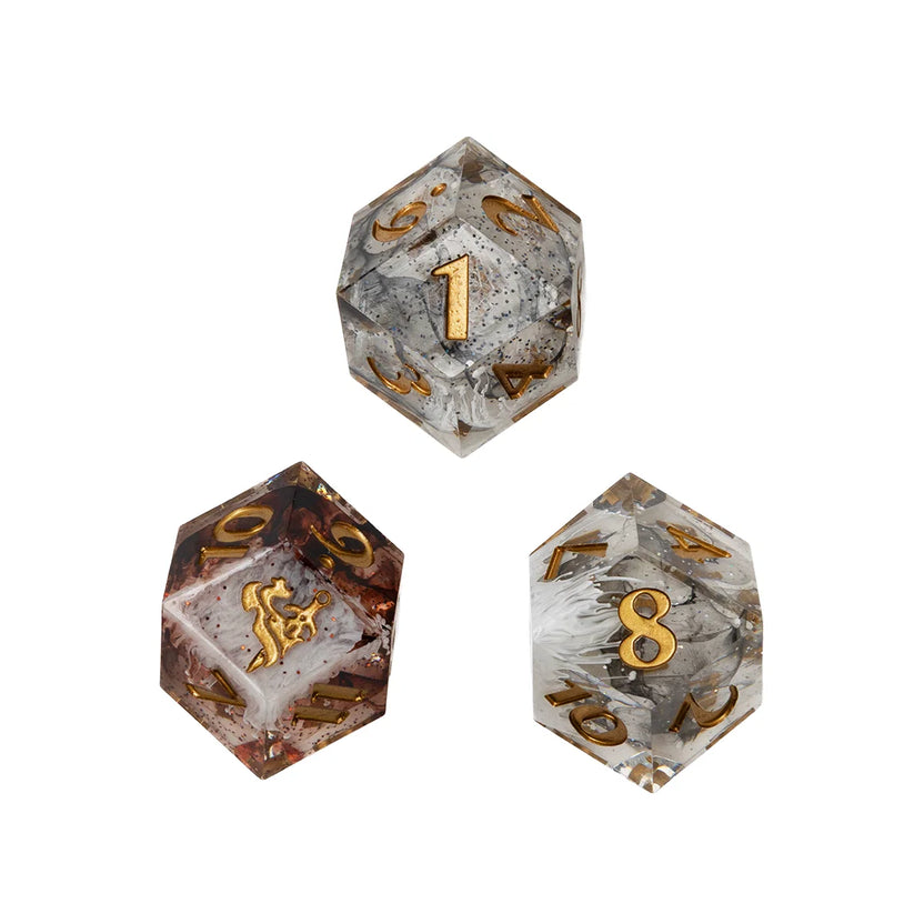 Close-up of black, brown, and gray Daggerheart Duality d12 dice with glitter and swirling white cores