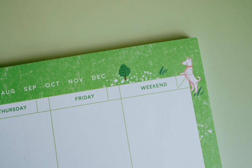 Detail of illustrated dogs along the edge of the Dog Days weekly planner