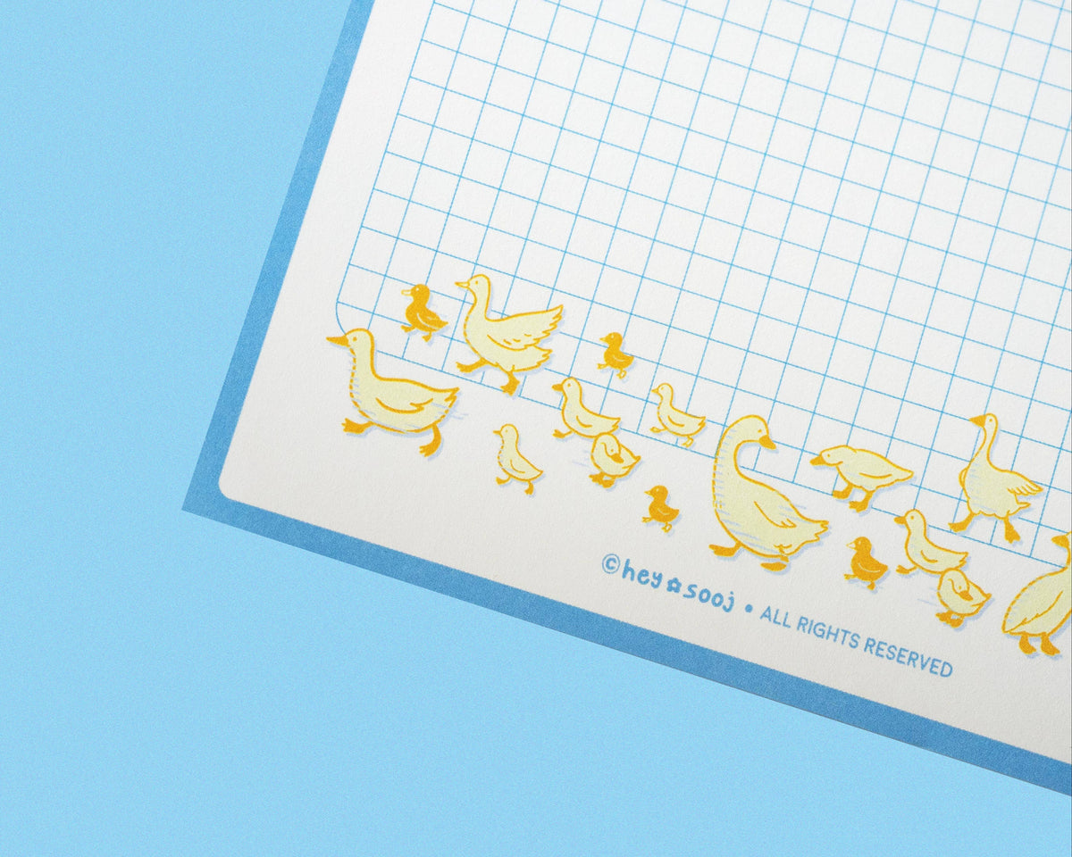 Yellow duck illustrations along the bottom of the Duck, Duck, Notes notepad