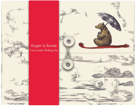 Elise Hurst Flying Bear letter writing set in its illustrated keepsake wallet featuring a bear holding an umbrella beneath a cloudy sky.