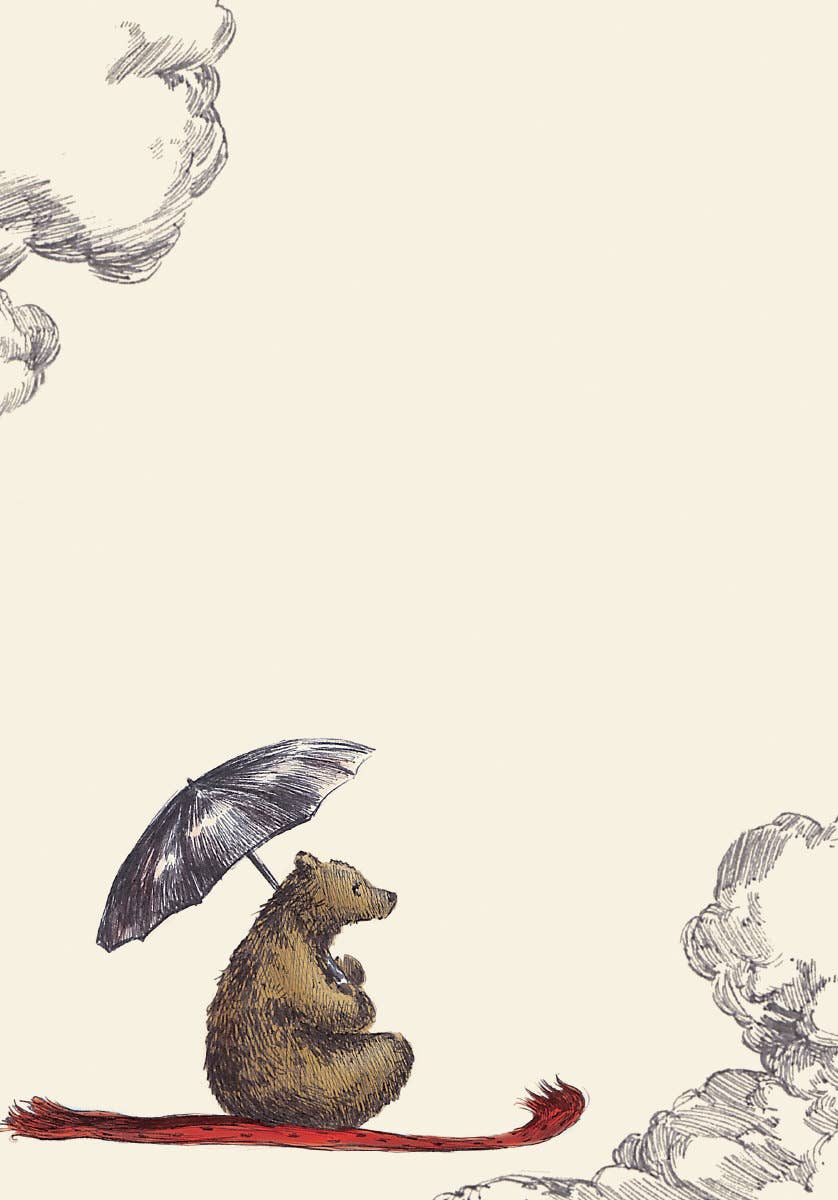 Writing paper from the Elise Hurst Flying Bear letter writing set featuring a small bear beneath an umbrella surrounded by illustrated clouds.