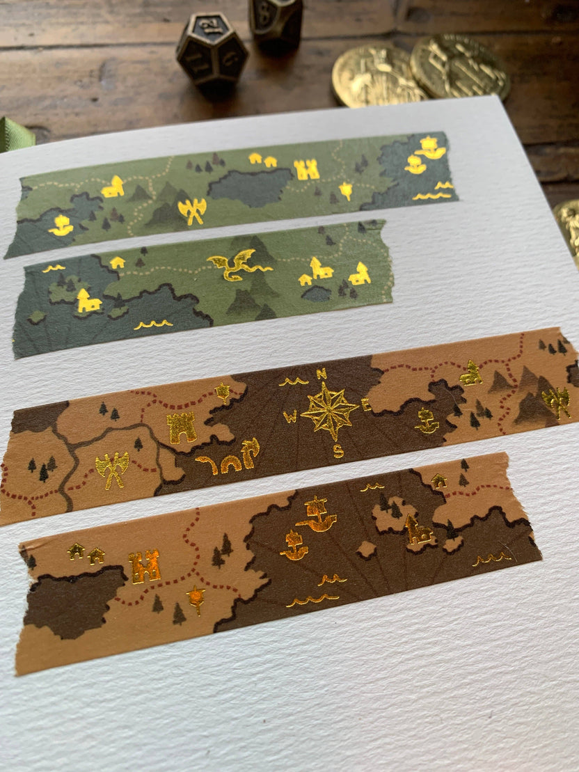 fantasy map washi tape, gold foil washi tape, D&D journal accessories, map design washi, RPG washi tape, character sheet decoration, eco-friendly washi tape, travel journal tape, parchment-style washi, green blue washi tape, brown washi tape, worldbuilding stationery, fantasy-themed washi, scrapbooking tape, biodegradable rice paper tape