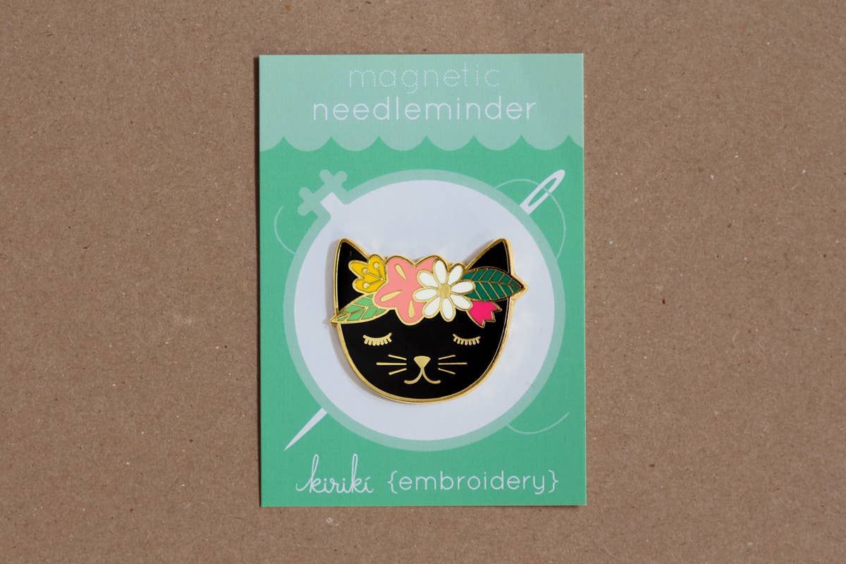 floral cat needleminder, enamel magnetic needle holder, cute cat needle minder, embroidery accessories, cross-stitch supplies, hoop needle magnet, rare earth magnet needleminder, cat-themed sewing tool, stitcher gift idea, magnetic needle keeper