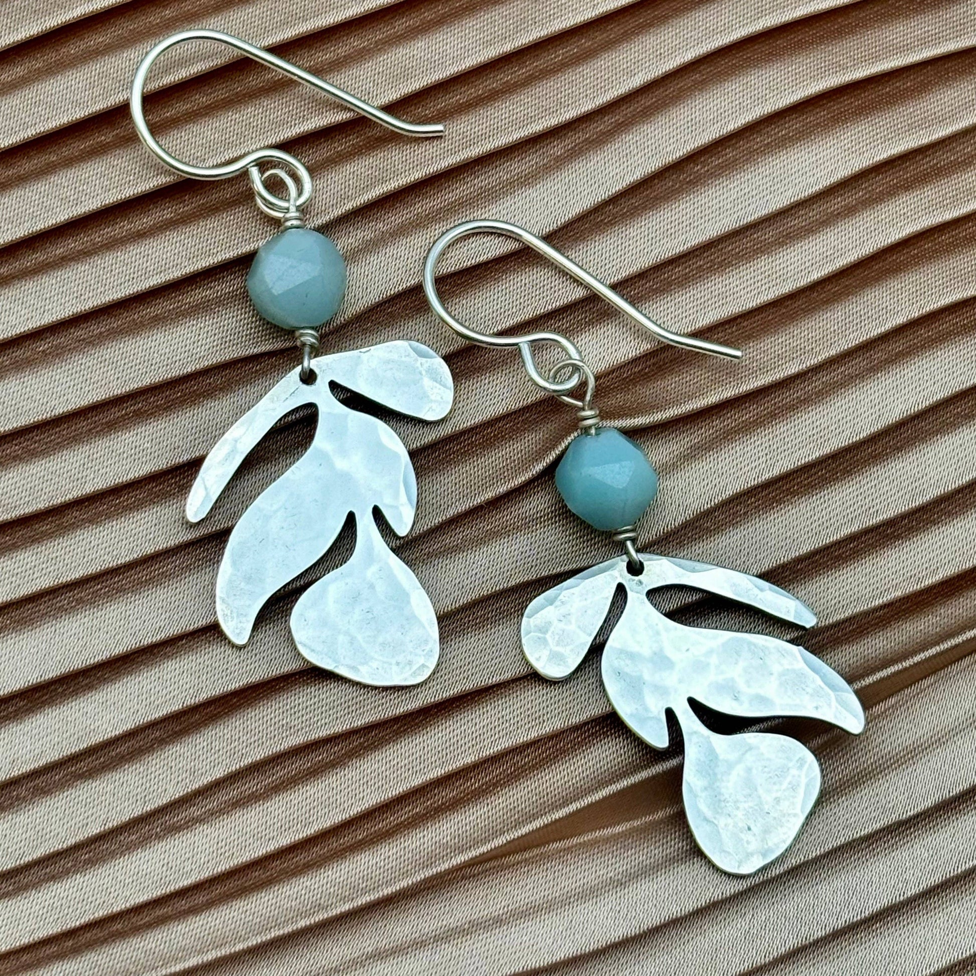 flow earrings silver, amazonite bead earrings, geometric nature earrings, silver triangle and leaf earrings, sterling silver plated earrings, minimalist botanical jewelry, handmade silver earrings, everyday amazonite earrings, silver and gemstone earrings, lightweight silver earrings, hypoallergenic silver earrings, silver dangle earrings with bead, natural balance earrings, modern boho jewelry, clean line earrings