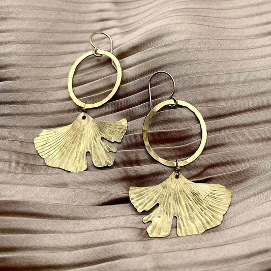 ginkgo earrings gold, ginkgo leaf jewelry, brass ginkgo earrings, gold hoop leaf earrings, gold filled ear wire earrings, hypoallergenic botanical earrings, nature inspired jewelry, ginkgo tree symbol earrings, handmade ginkgo earrings, raw brass botanical earrings, graceful gold dangle earrings, elegant leaf earrings, ginkgo hoop earrings, everyday gold earrings, artful nature earrings
