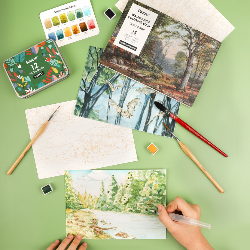 Grabie Forest Watercolor Coloring Club Box held in two hands