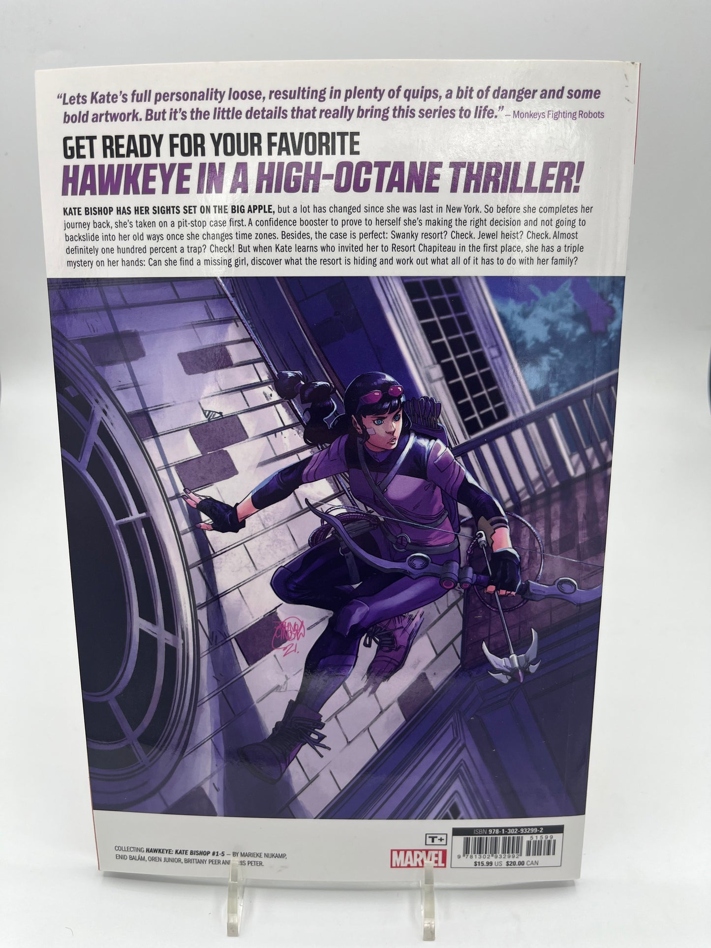 Back cover featuring Kate Bishop as Hawkeye scaling a building with her bow, along with the series description and Marvel Comics publishing information.