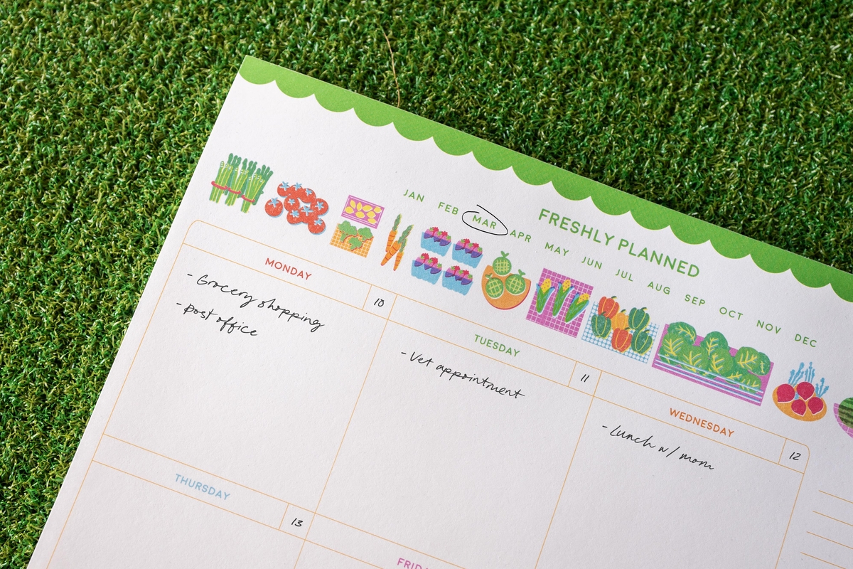 Freshly Planned weekly planner with colorful farmers market illustrations