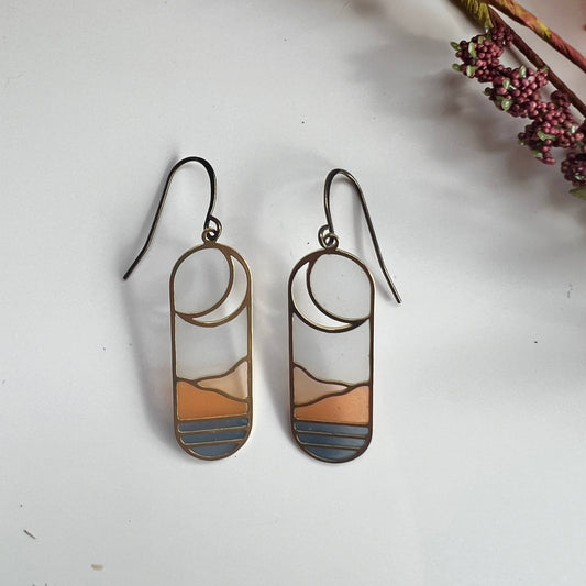 horizon earrings, stained glass earrings, resin brass earrings, landscape earrings, handmade dangle earrings, modern art jewelry, lightweight artisan earrings, boho nature earrings, scenic resin earrings, everyday statement earrings, brass and resin jewelry, Rogue & Rye accessories, unique handmade gifts, nature-inspired fashion, colorful dangle earrings, artistic resin earrings, handcrafted earrings for women, gift for nature lovers, soft pastel earrings, modern nature jewelry
