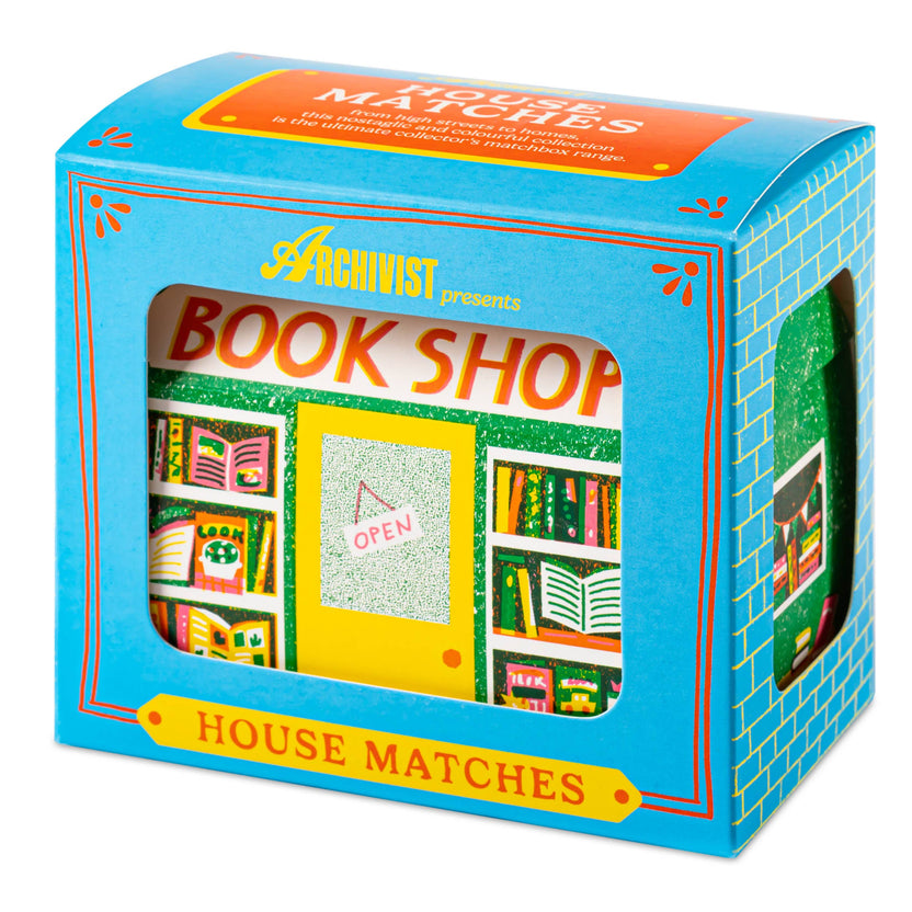 Bookshop matchbox, house-shaped safety matches, The Printed Peanut illustration, bookstore matchbox design, book lover gifts, bibliophile accessories, Archivist House Match collection, whimsical illustrated matchbox, UK-made safety matches, reading nook décor, collectible matchbox art, Rogue & Rye curated gifts, colorful bookshop artwork, artisan matchboxes.