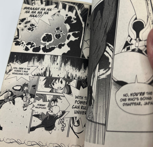 Interior manga pages from Kingdom Hearts Volume 2 featuring Sora, Donald Duck, and fantasy action scenes adapted from the Disney and SquareSoft adventure.