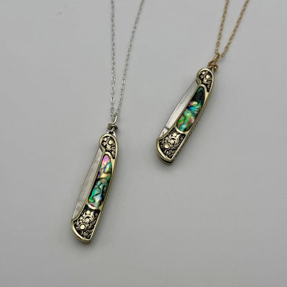 lennox necklace knife, mini knife necklace gold, abalone pocket knife jewelry, stealthy knife pendant, gold filled knife necklace, functional knife jewelry, filigree knife necklace, vintage inspired utility necklace, pocket knife necklace for women, adventurer jewelry, abalone shell pendant knife, necklace with hidden blade, fashionable self defense necklace, secret blade necklace, gold mini knife pendant