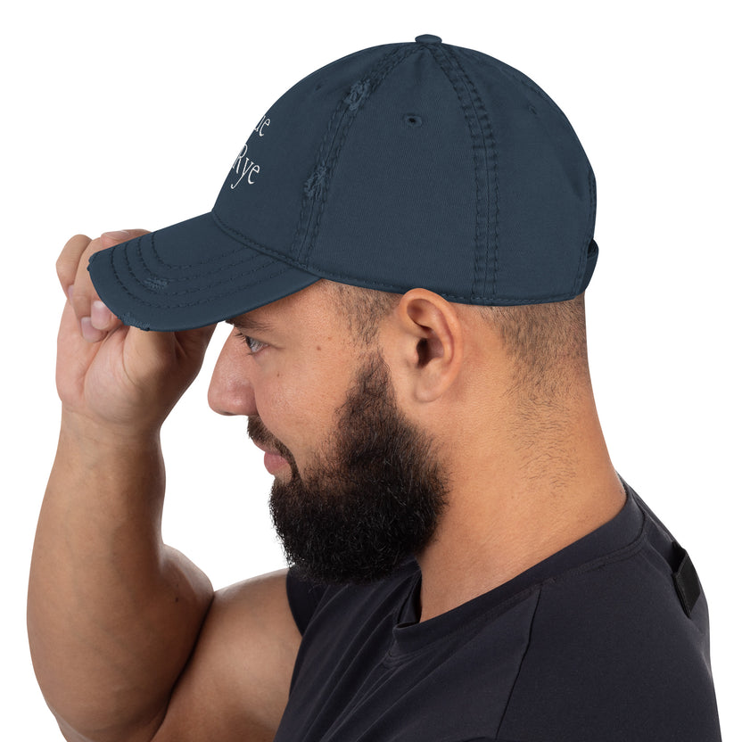 and well-worn pride cap, distressed pride hat, inclusive embroidered hat, rogue and rye lgbtq gear, queer and proud cap, lived-in pride cap, soft cotton twill hat, outright international donation, evolving identity hat, rogue and rye pride collection, gender inclusive pride wear, adjustable distressed cap, embroidered and message, everyday queer pride gear, unstructured pride cap, pride fashion hat, lgbtq supportive cap