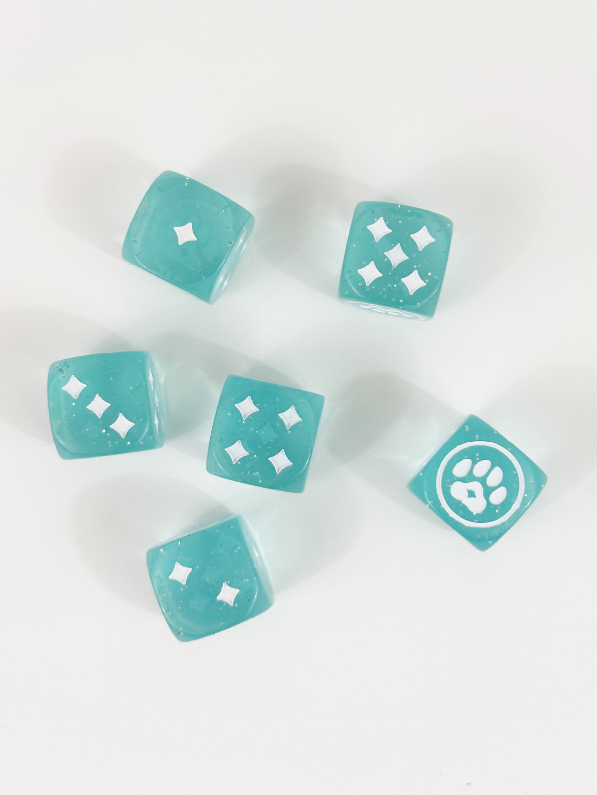 Sparkly blue dice with custom kitty paw symbols for Magical Kitties Save the Day