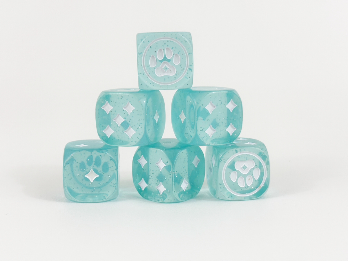 Six sparkly blue Kitty Paw Dice stacked together