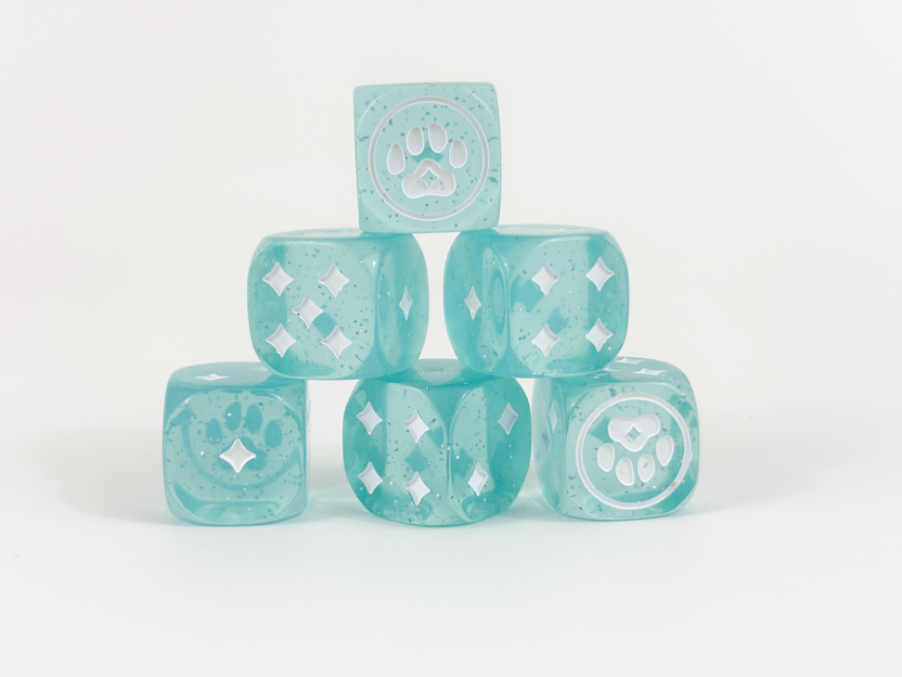 Six sparkly blue Kitty Paw Dice stacked together