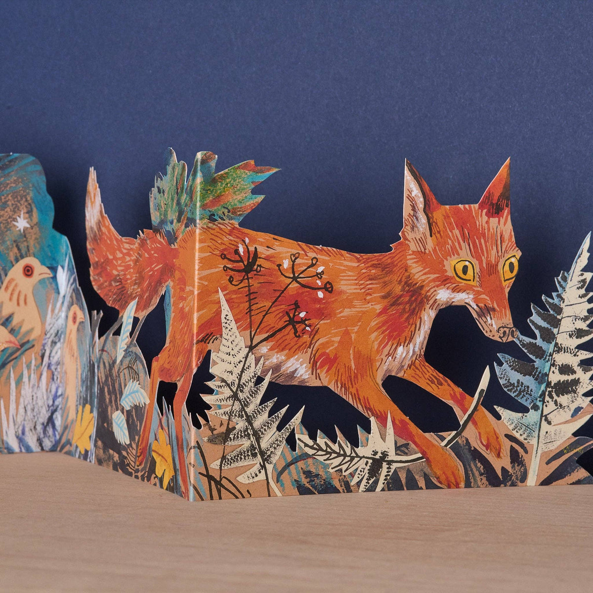Mark Hearld Three Fold Fox accordion greeting card featuring a close-up of the fox within the layered woodland paper sculpture.