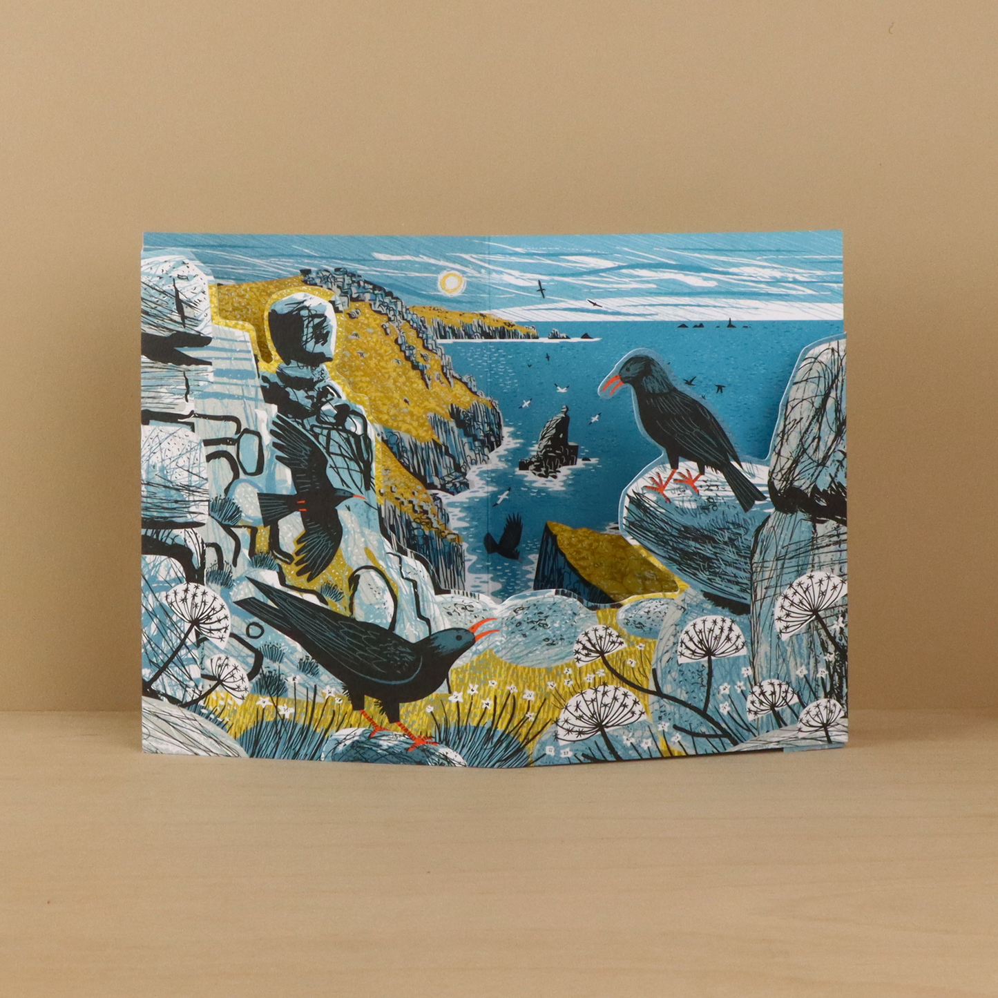Front of the Matt Johnson Mayon Cliff Choughs greeting card featuring choughs perched on rugged coastal cliffs above the sea.