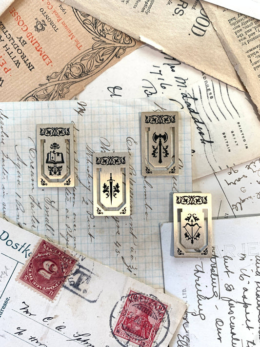 brass page markers, metal bookmarks, mini brass bookmarks, journal accessories, planner bookmarks, reusable bookmarks, aesthetic stationery, brass stationery gifts, book lover gifts, thin metal page markers, sketchbook bookmark set, minimalist bookmark set, golden page tabs, durable metal tabs, vintage-inspired book accessories