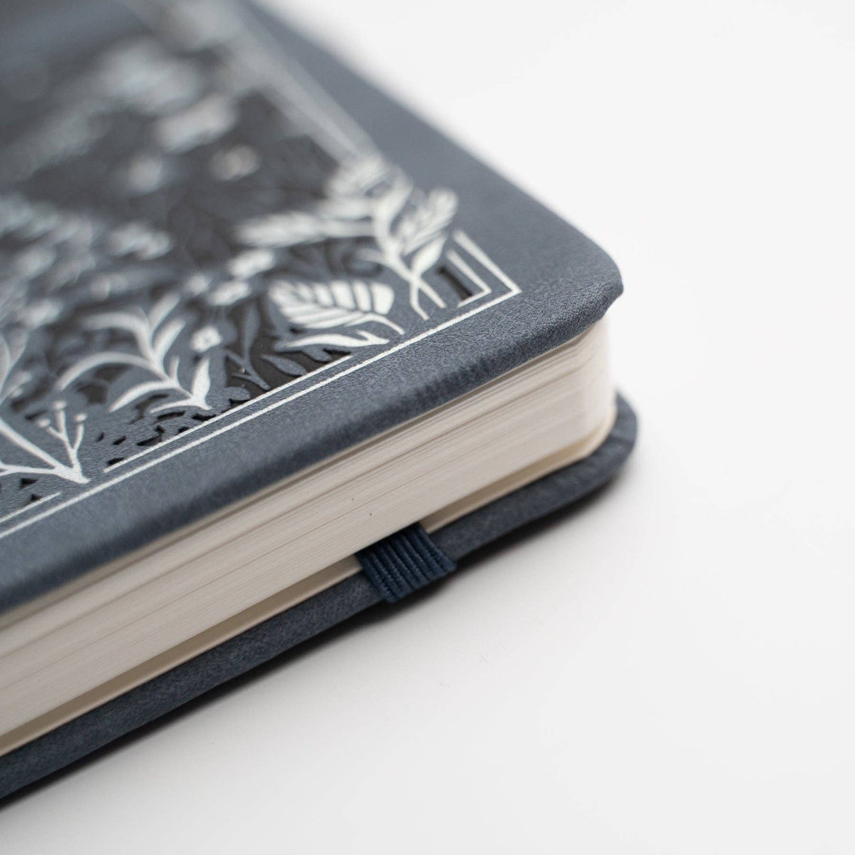 Close-up of Moonlit Garden notebook binding and thick kraft pages