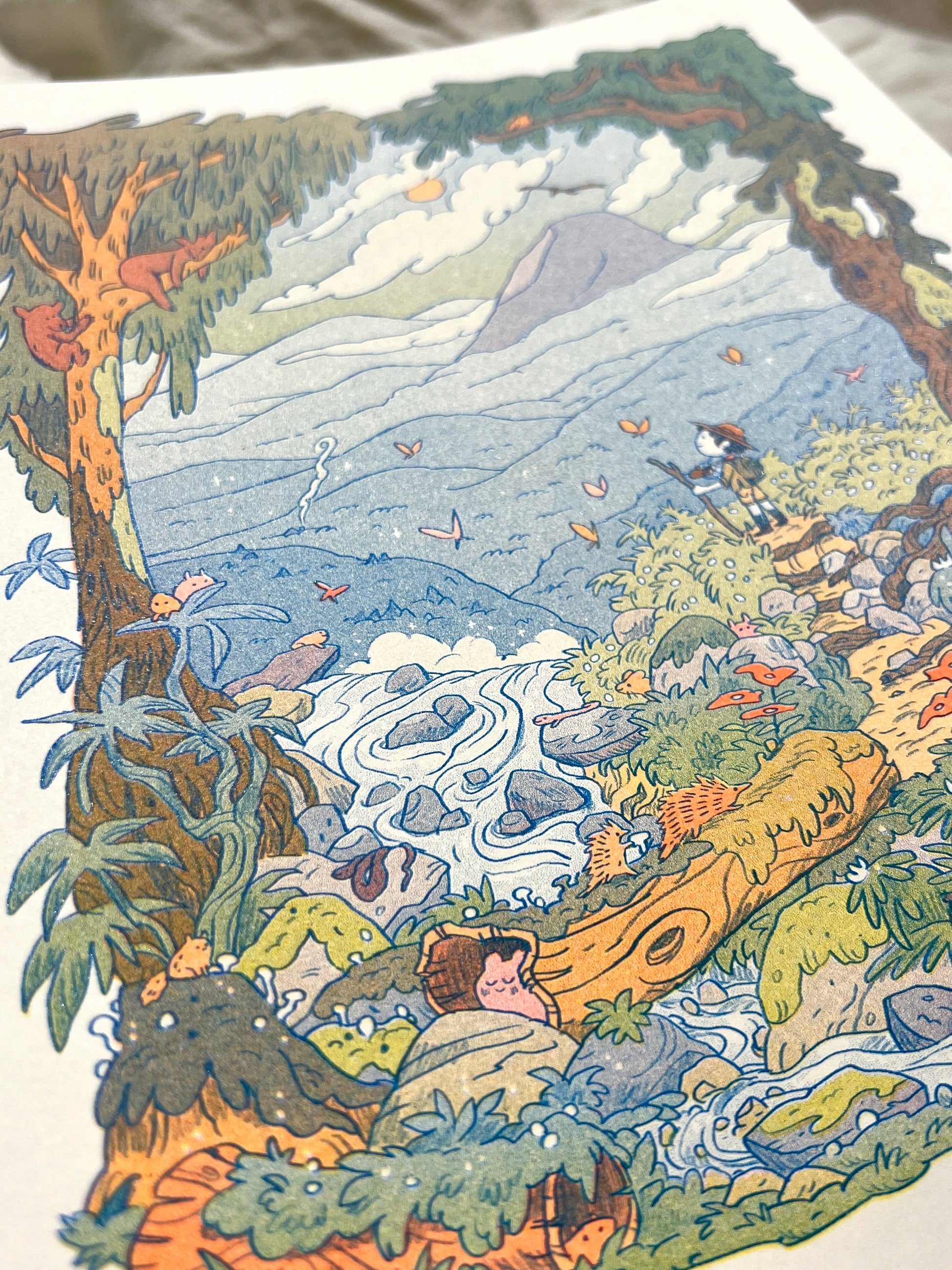 Mountain Dreams risograph print, mountain landscape riso art, Natalie Andrewson riso print, blue fluorescent orange yellow riso, scenic mountain illustration, wanderer wall art, adventure-inspired riso print, indie printmaker artwork, dreamy mountain landscape print, vibrant layered ink art, collectible riso print, Rogue & Rye artist collection.