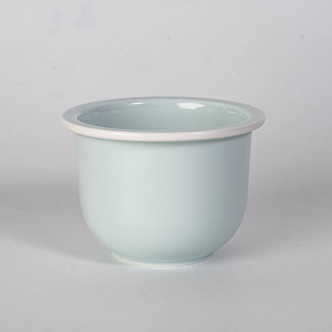 green mountain tea mug, porcelain tea mug with infuser, Urban Tokyo tea mug green, Japanese-style tea brewing mug, loose leaf tea porcelain cup, lidded infuser mug, minimalist green tea mug, modern Japanese home goods, gift for tea drinkers, mountain design mug, cozy kitchen gifts, ceramic tea mug with lid, Rogue & Rye cozy rituals collection, elegant tea accessories, woman-owned brand gift ideas.