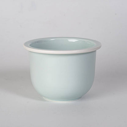 green mountain tea mug, porcelain tea mug with infuser, Urban Tokyo tea mug green, Japanese-style tea brewing mug, loose leaf tea porcelain cup, lidded infuser mug, minimalist green tea mug, modern Japanese home goods, gift for tea drinkers, mountain design mug, cozy kitchen gifts, ceramic tea mug with lid, Rogue & Rye cozy rituals collection, elegant tea accessories, woman-owned brand gift ideas.