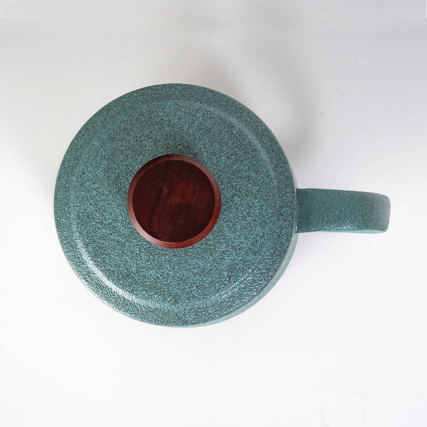 green mountain tea mug, porcelain tea mug with infuser, Urban Tokyo tea mug green, Japanese-style tea brewing mug, loose leaf tea porcelain cup, lidded infuser mug, minimalist green tea mug, modern Japanese home goods, gift for tea drinkers, mountain design mug, cozy kitchen gifts, ceramic tea mug with lid, Rogue & Rye cozy rituals collection, elegant tea accessories, woman-owned brand gift ideas.