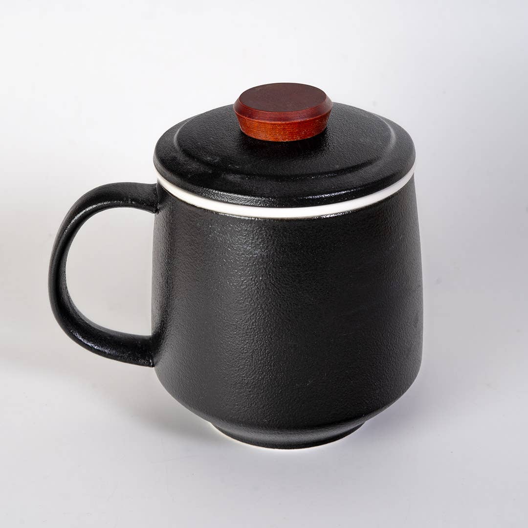 mountain tea mug, porcelain tea mug with infuser, Urban Tokyo tea mug, Japanese-style tea mug, loose-leaf tea brewing mug, black porcelain infuser mug, lidded tea mug, modern minimalist tea cup, gift for tea lovers, mountain design drinkware, elegant kitchen gifts, ceramic tea mug with strainer, Rogue & Rye cozy rituals collection, everyday tea essentials, Japanese home goods aesthetic.