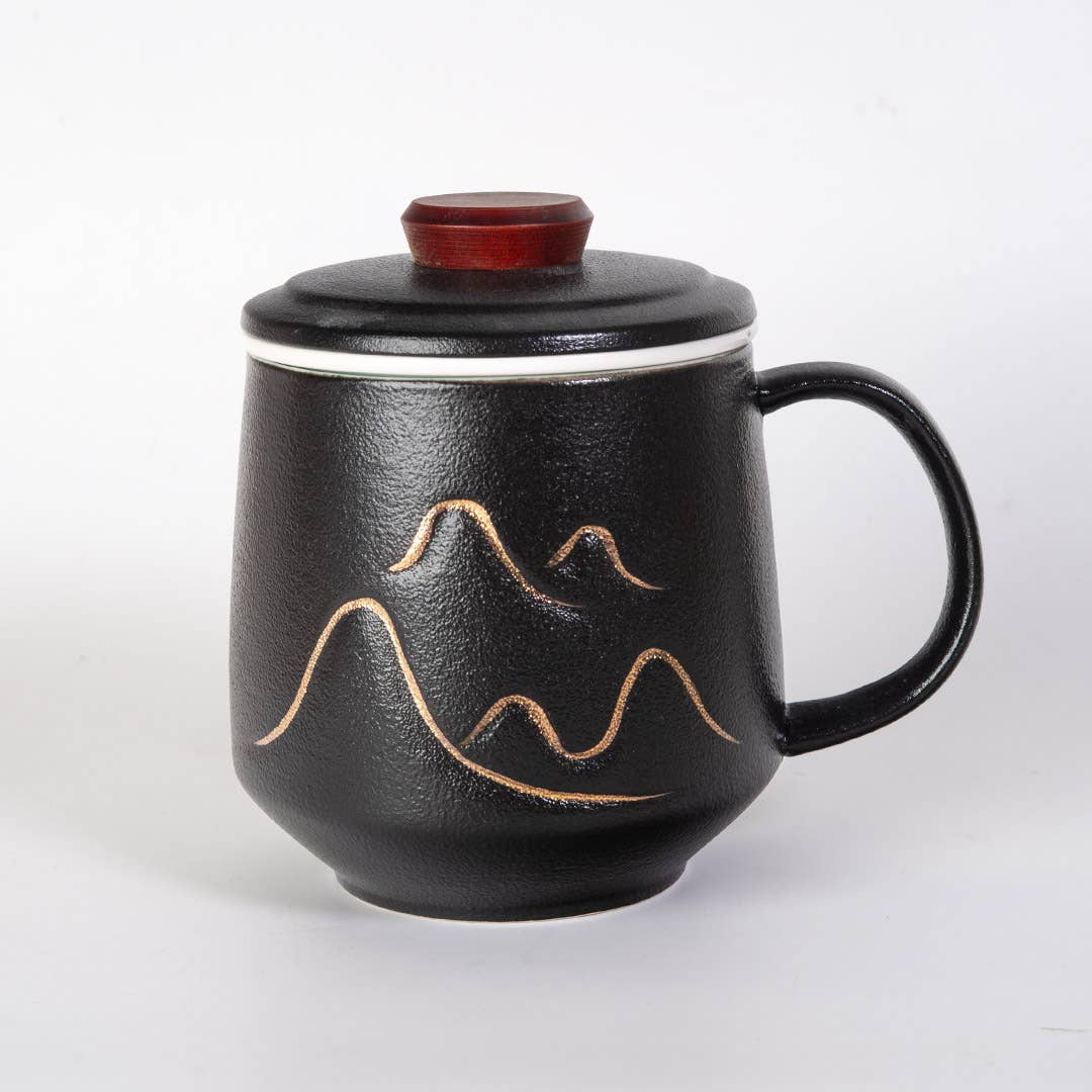 mountain tea mug, porcelain tea mug with infuser, Urban Tokyo tea mug, Japanese-style tea mug, loose-leaf tea brewing mug, black porcelain infuser mug, lidded tea mug, modern minimalist tea cup, gift for tea lovers, mountain design drinkware, elegant kitchen gifts, ceramic tea mug with strainer, Rogue & Rye cozy rituals collection, everyday tea essentials, Japanese home goods aesthetic.