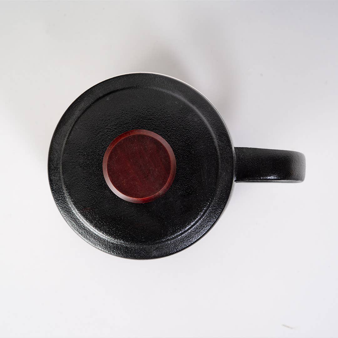 mountain tea mug, porcelain tea mug with infuser, Urban Tokyo tea mug, Japanese-style tea mug, loose-leaf tea brewing mug, black porcelain infuser mug, lidded tea mug, modern minimalist tea cup, gift for tea lovers, mountain design drinkware, elegant kitchen gifts, ceramic tea mug with strainer, Rogue & Rye cozy rituals collection, everyday tea essentials, Japanese home goods aesthetic.