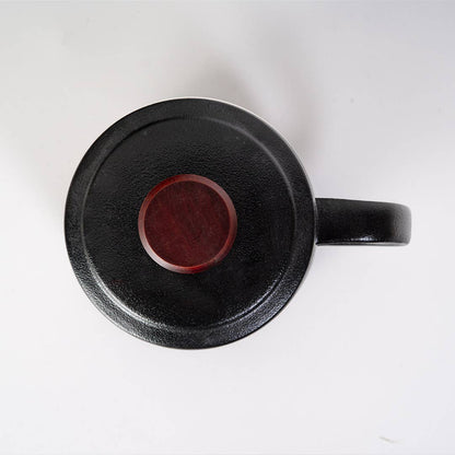 mountain tea mug, porcelain tea mug with infuser, Urban Tokyo tea mug, Japanese-style tea mug, loose-leaf tea brewing mug, black porcelain infuser mug, lidded tea mug, modern minimalist tea cup, gift for tea lovers, mountain design drinkware, elegant kitchen gifts, ceramic tea mug with strainer, Rogue & Rye cozy rituals collection, everyday tea essentials, Japanese home goods aesthetic.