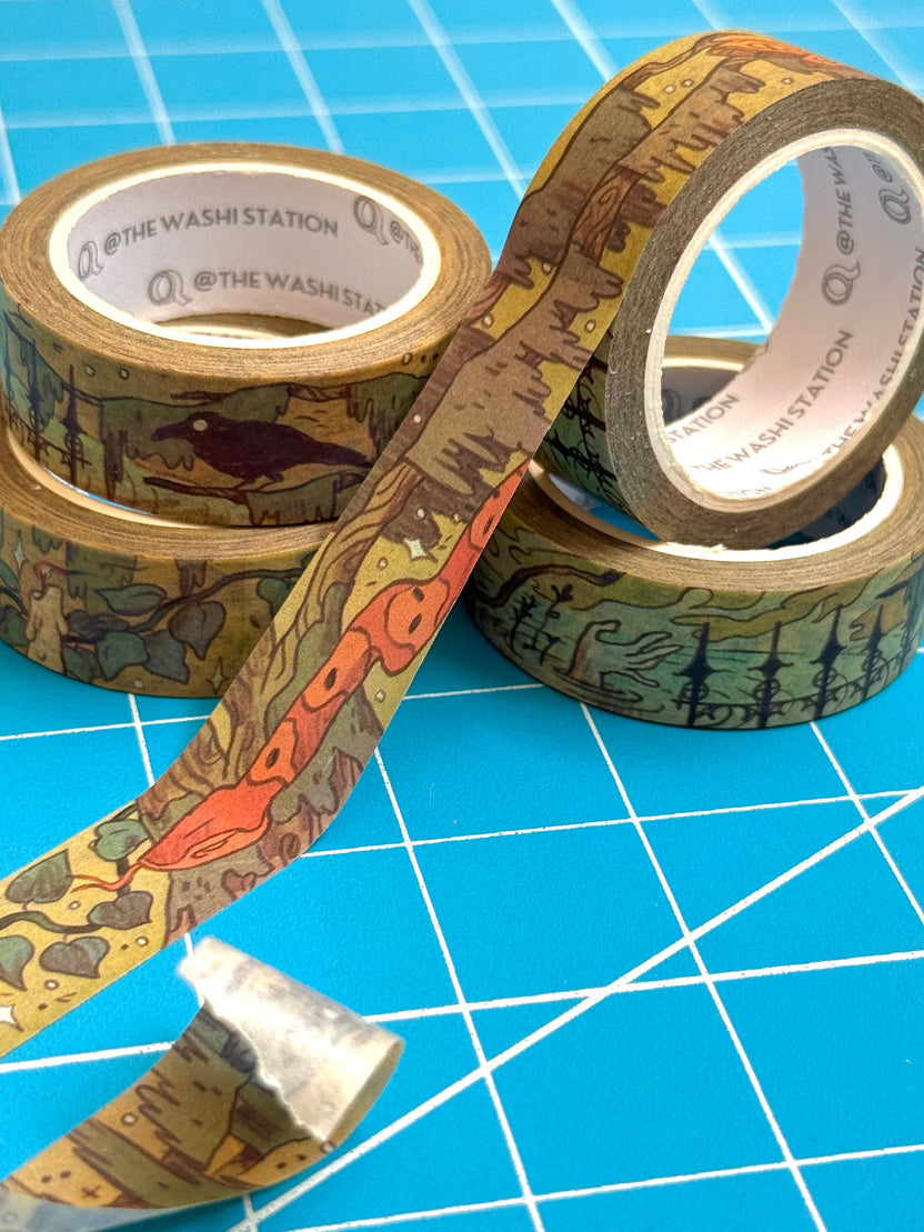 Natalie Andrewson illustrated literary washi tape shown partially unrolled beside the roll