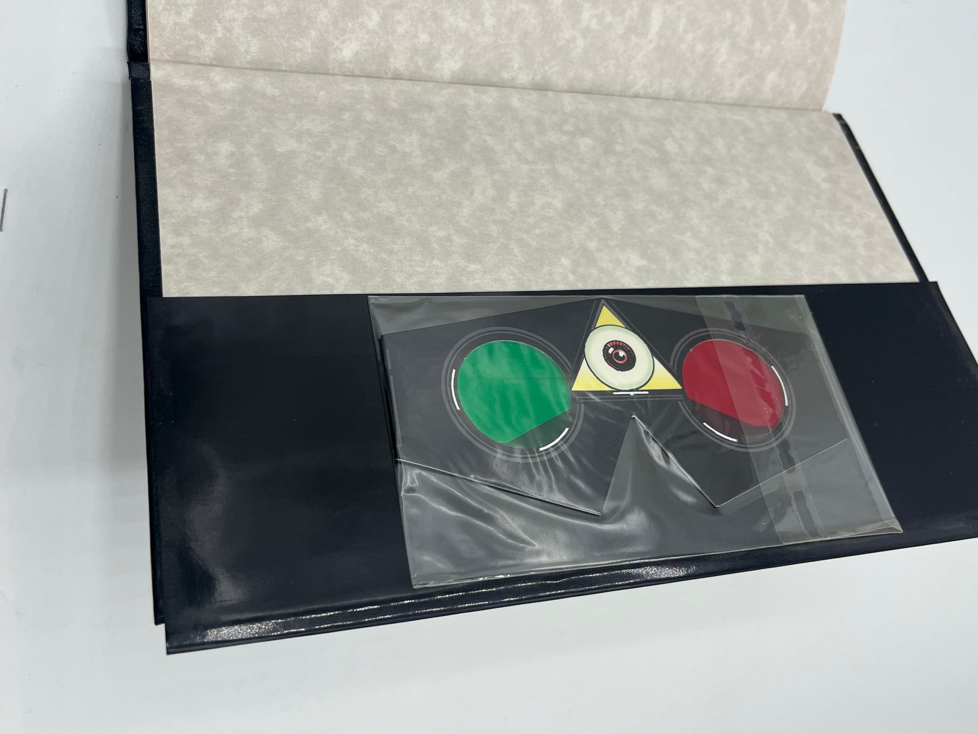 Preowned Like New hardcover edition of The League of Extraordinary Gentlemen: The Black Dossier by Alan Moore and Kevin O’Neill. This premium-format graphic novel is known for its inventive “dossier” presentation and collectible design, including a 3-D section in many editions. A great pick for fans of literary mashups, steampunk/alt-history comics, and high-design graphic novel hardcovers.