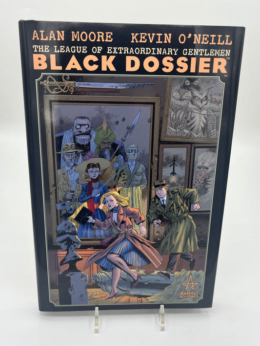Preowned Like New hardcover edition of The League of Extraordinary Gentlemen: The Black Dossier by Alan Moore and Kevin O’Neill. This premium-format graphic novel is known for its inventive “dossier” presentation and collectible design, including a 3-D section in many editions. A great pick for fans of literary mashups, steampunk/alt-history comics, and high-design graphic novel hardcovers.