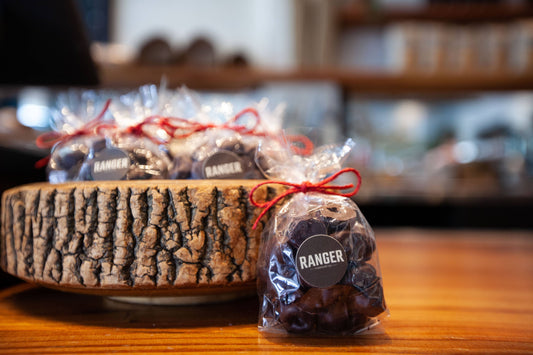 dark chocolate cherries, chocolate covered bing cherries, Hood River cherries, Oregon cherry gifts, small batch chocolate Portland, Ranger Chocolate Co., seasonal chocolate treats, artisan chocolate cherries, premium dark chocolate 70 percent, gourmet chocolate gifts under 20, Pacific Northwest specialty foods, ethical chocolate brands, organic cacao chocolate, Rogue and Rye artisan foods, holiday stocking stuffers, chocolate coated fruit, chocolate gifts Portland Oregon, handcrafted confectionery, bean to 