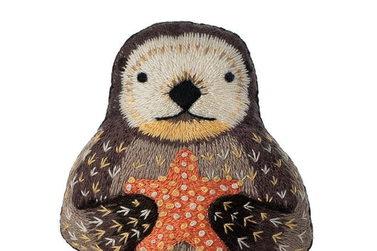 otter embroidery kit, Kiriki Press otter, embroidered animal doll kit, DIY embroidery plushie, level 3 embroidery kit, otter stitch doll project, hand embroidery kit for adults, advanced embroidery pattern, embroidered otter craft kit, otter needlework gift idea