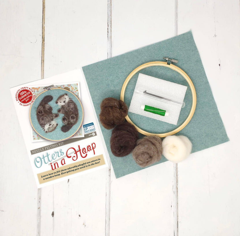 otters needle felting kit, otters in a hoop craft kit, painting with wool otters, beginner needle felting project, diy wool animal art, corriedale wool felting kit, 2d felting kit with hoop, otter wall art craft kit, crafty kit company otters, wool felt otter kit, felt animal couple project, scottish felting kits, embroidery hoop felt animals, felt otter gift idea, eco-friendly craft kit