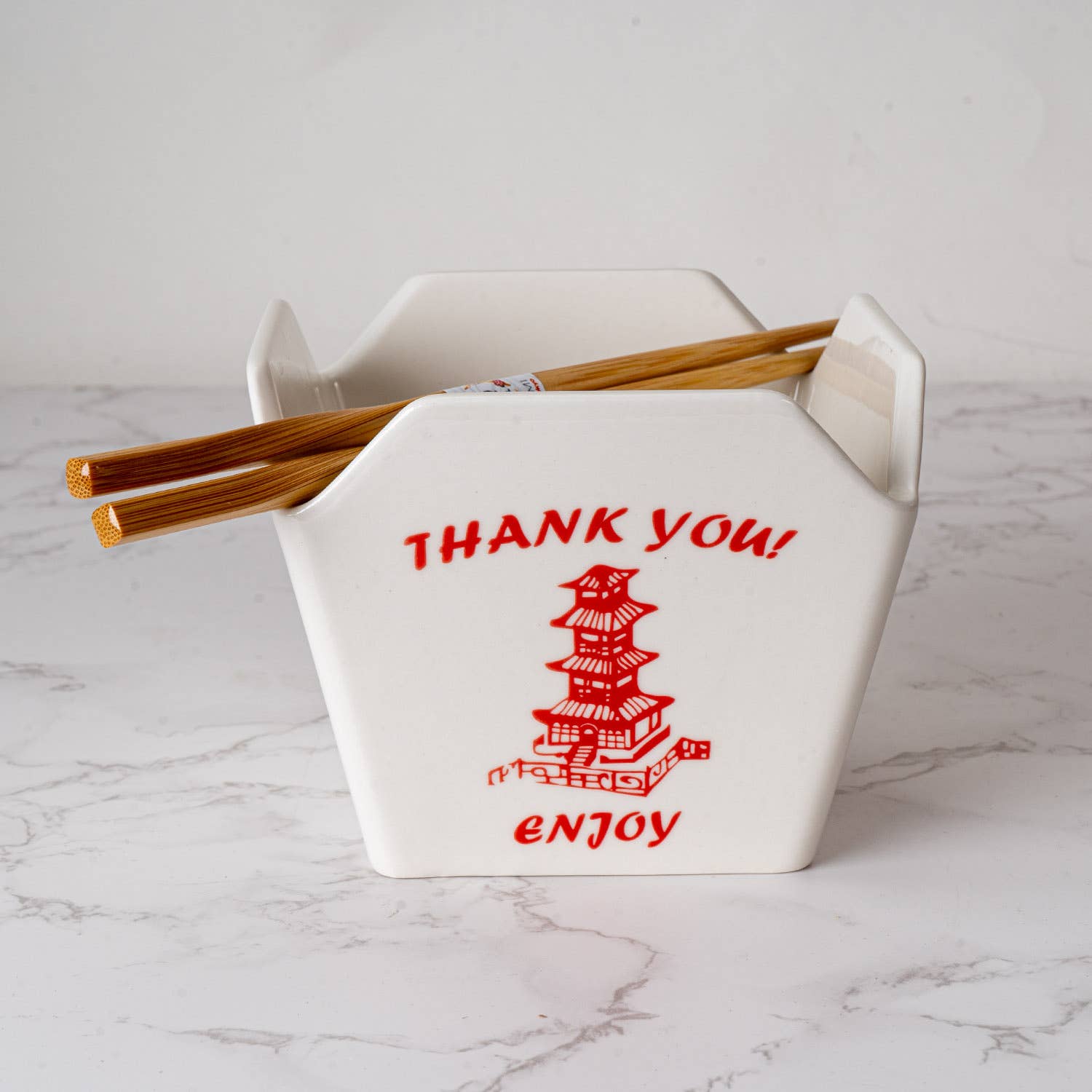 pagoda takeout box bowl, ceramic ramen bowl with chopsticks, reusable takeout container bowl, Urban Tokyo pagoda bowl, Japanese-style noodle bowl, microwave safe ceramic bowl, dishwasher safe takeout bowl, fun kitchen gift, Asian-inspired dinnerware, noodle bowl with chopstick holder, Rogue & Rye kitchen and home collection, ceramic takeout design, red pagoda bowl gift.