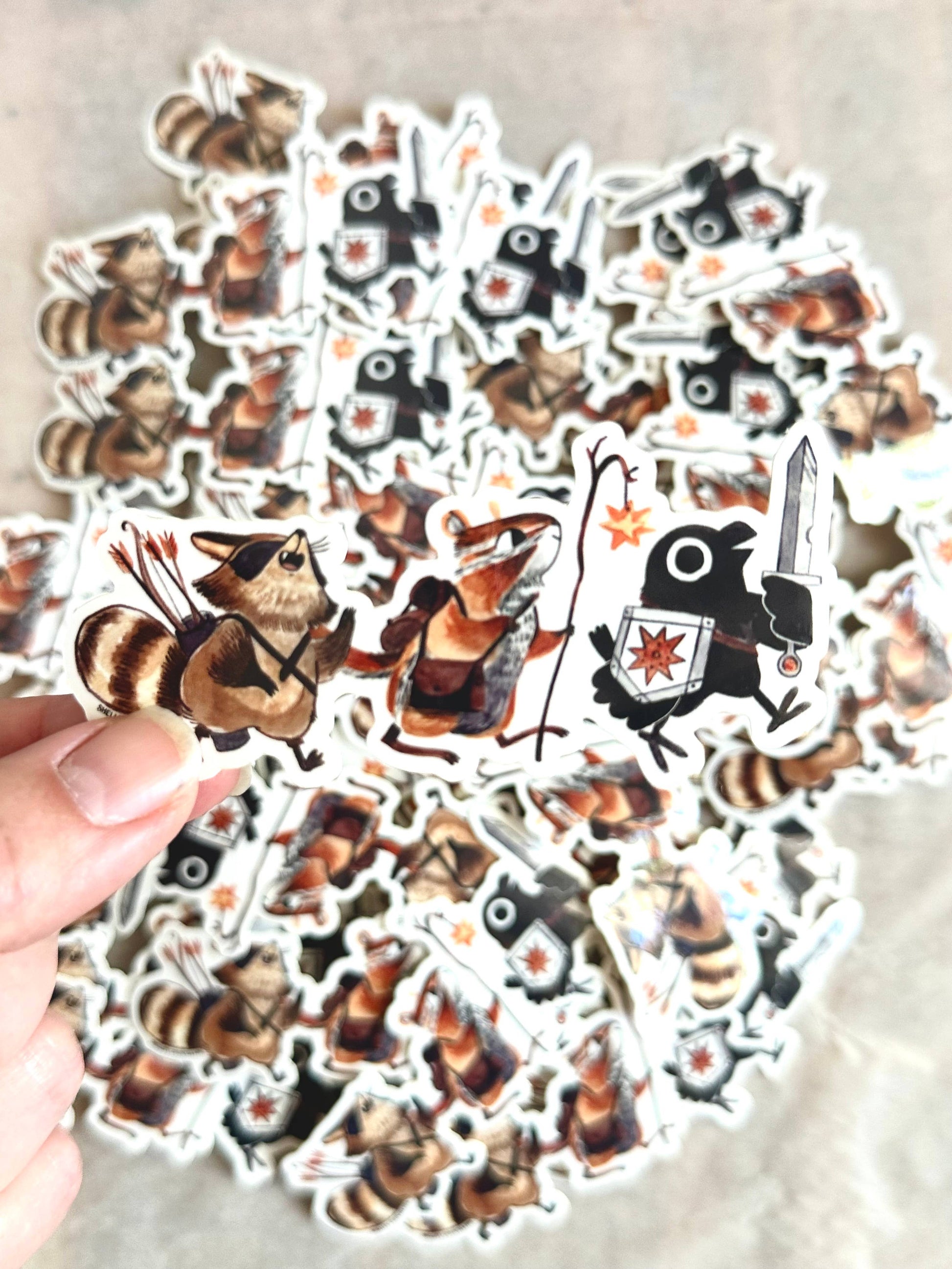 adventuring party animal sticker, raccoon and crow vinyl sticker, dnd animal party sticker, fantasy animal adventurers, chipmunk wizard sticker, rogue raccoon sticker, crow with sword art, waterproof rpg sticker, vinyl dnd character sticker, cute animal adventurers decal