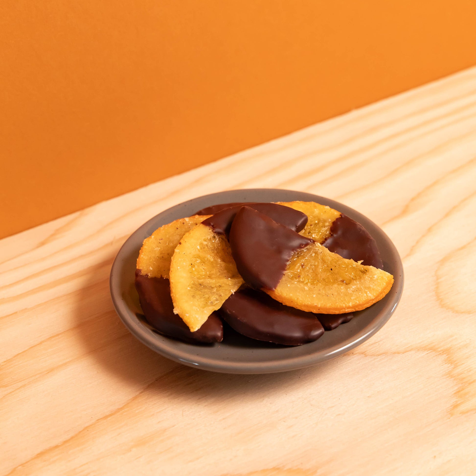 candied oranges in dark chocolate, chocolate-covered oranges, artisan chocolate Portland Oregon, small-batch chocolate, Ranger Chocolate Co., award-winning chocolate 2025, handcrafted chocolate gifts, gourmet citrus chocolate, premium organic cacao, bean-to-bar chocolate Portland, fair trade chocolate treats, holiday chocolate gifts, Rogue and Rye artisan foods, Pacific Northwest chocolate makers, chocolate for gifting, ethical chocolate brands, Portland specialty foods, chocolate dipped fruit, citrus confe