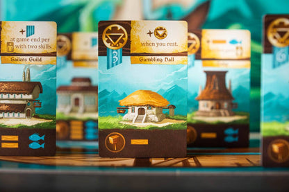 Islebound Emerald Edition, Islebound board game, Red Raven Games Islebound, World of Arzium board game, Ryan Laukat game, sea faring strategy board game, nautical fantasy board game, archipelago board game, pirates and sea monsters board game, trade build invade board game, island town strategy game, capital city building board game, crew hiring board game, emerald resource board game, revised building deck Emerald Edition, 2 to 4 player strategy game, 30 minute strategy board game, fantasy adventure strate