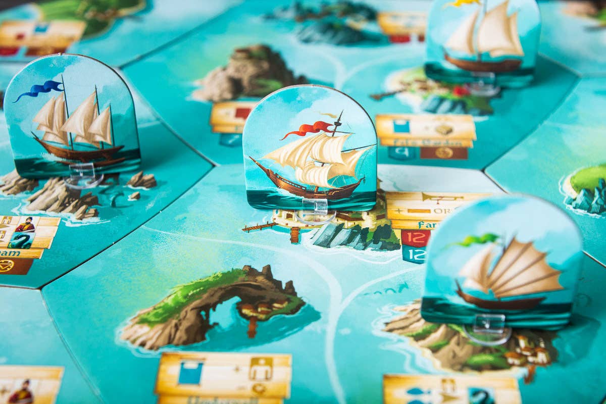 Islebound Emerald Edition, Islebound board game, Red Raven Games Islebound, World of Arzium board game, Ryan Laukat game, sea faring strategy board game, nautical fantasy board game, archipelago board game, pirates and sea monsters board game, trade build invade board game, island town strategy game, capital city building board game, crew hiring board game, emerald resource board game, revised building deck Emerald Edition, 2 to 4 player strategy game, 30 minute strategy board game, fantasy adventure strate