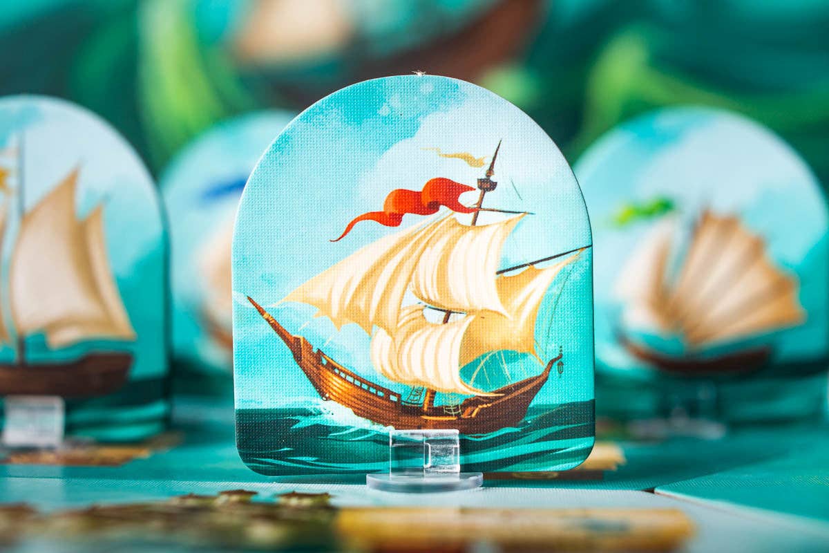 Islebound Emerald Edition, Islebound board game, Red Raven Games Islebound, World of Arzium board game, Ryan Laukat game, sea faring strategy board game, nautical fantasy board game, archipelago board game, pirates and sea monsters board game, trade build invade board game, island town strategy game, capital city building board game, crew hiring board game, emerald resource board game, revised building deck Emerald Edition, 2 to 4 player strategy game, 30 minute strategy board game, fantasy adventure strate