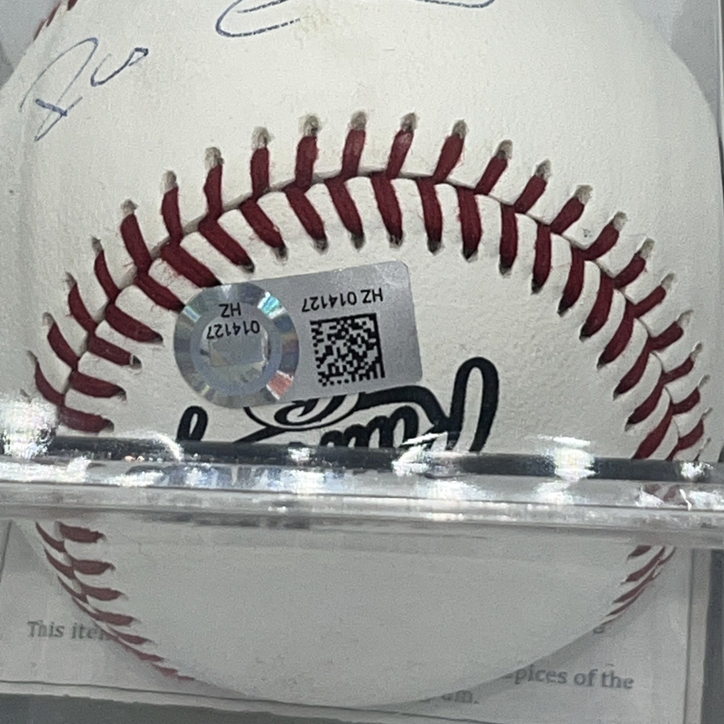 Close-up of the MLB authentication hologram affixed to a Robinson Canó autographed baseball.