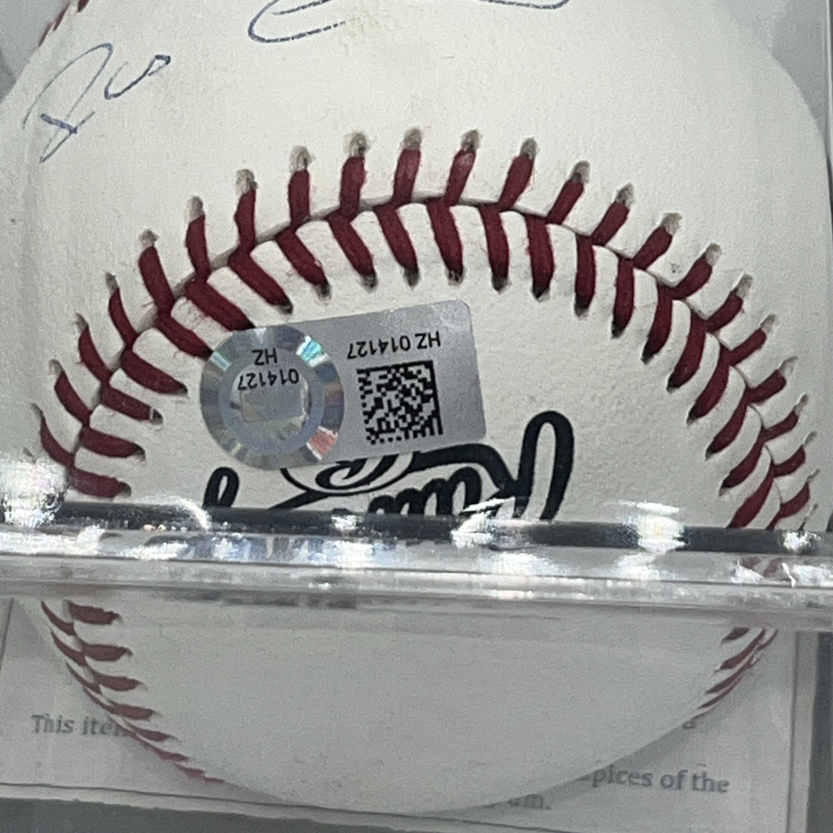 Close-up of the MLB authentication hologram affixed to a Robinson Canó autographed baseball.