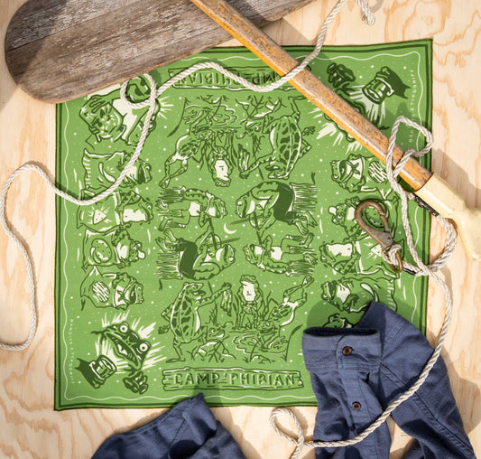 The Camp Phibian Bandana by Bandits Bandanas features original artwork by Lauren Griffin and is crafted from GOTS-certified, Fair Trade Certified organic cotton. Soft, breathable, and easy to style, this 21" × 21" bandana is perfect for everyday wear—tied at the neck, in the hair, or on a favorite bag. Each purchase gives back, with 10% of proceeds supporting The Brigid Alliance, making it a meaningful, artist-driven accessory designed to be lived in.
